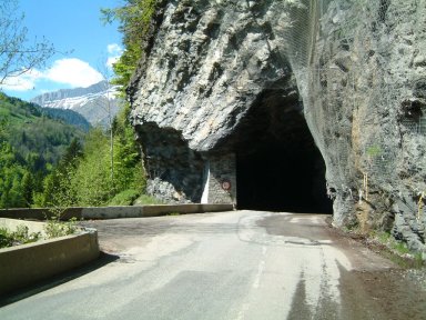 The road follows the rocks. In the middle distance, here is 